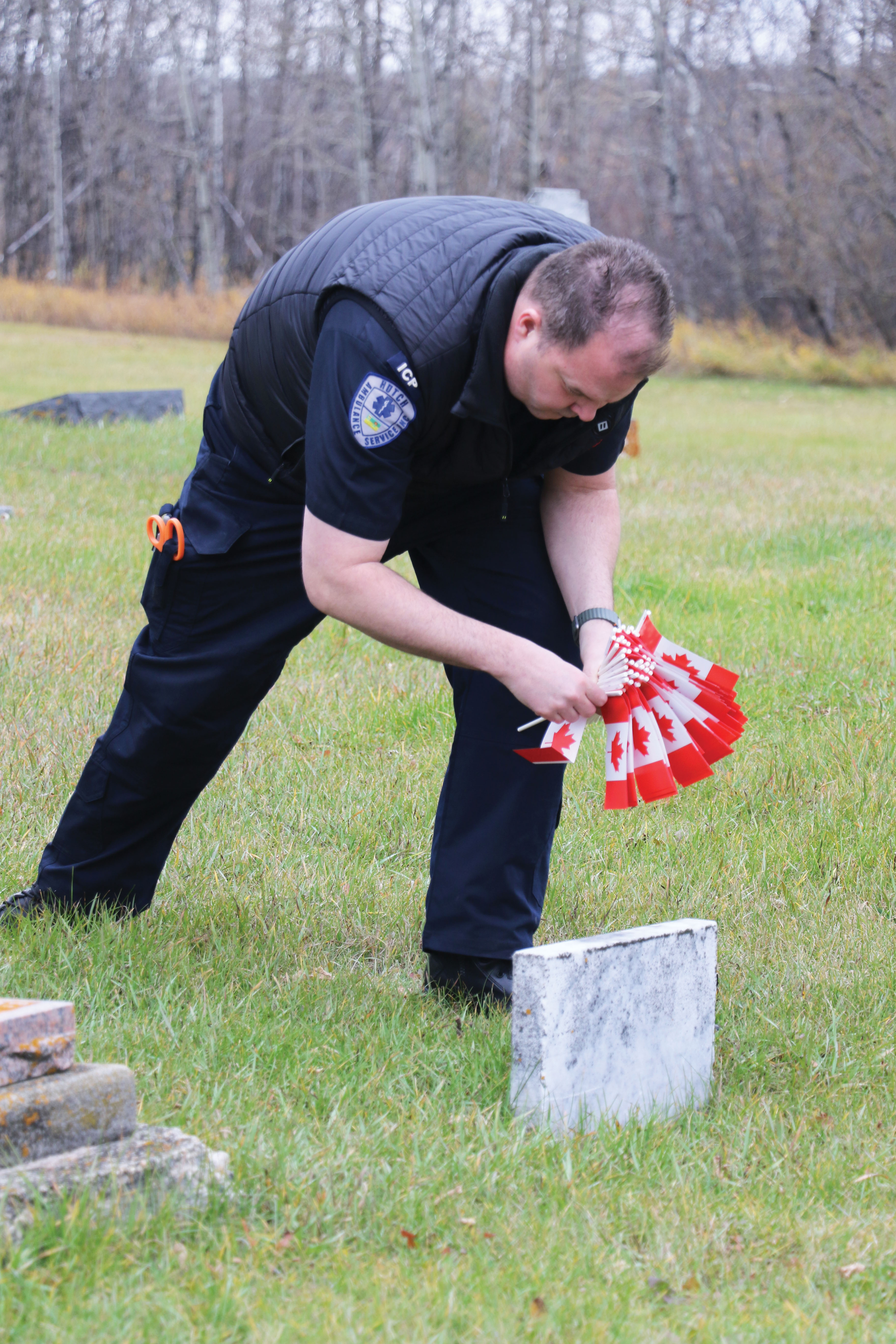 Clay Leduc getting ready to place a flag.