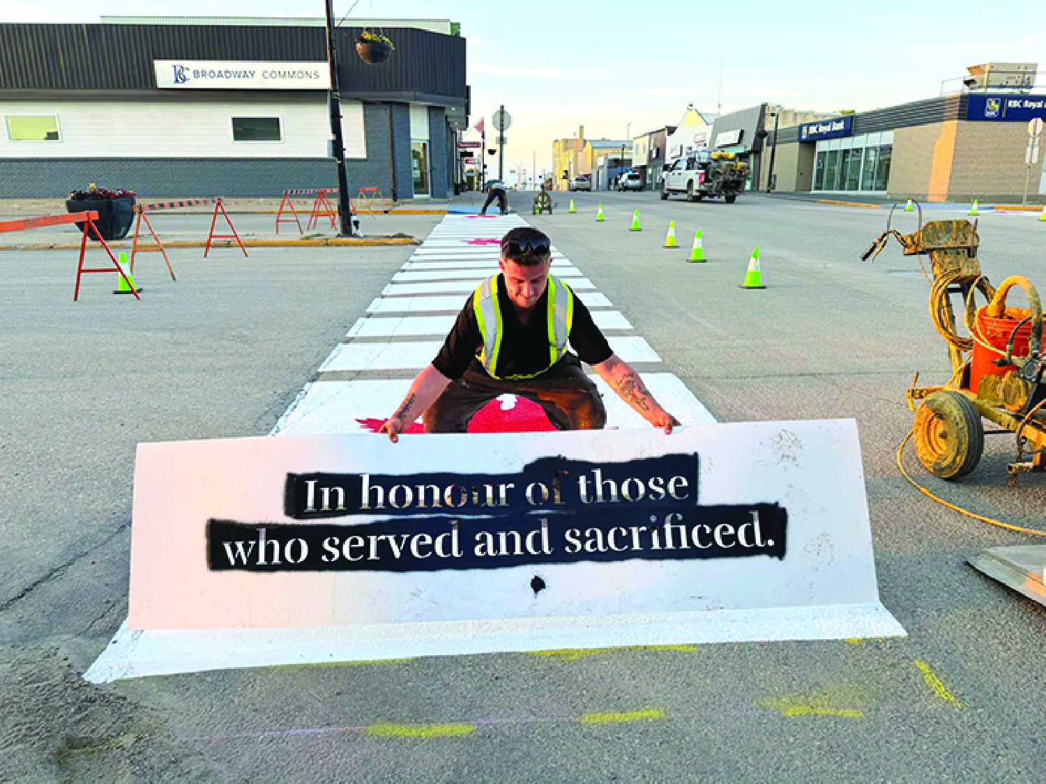 The Legion crosswalk being painted on Main Street in Moosomin by Lotworx on Thursday evening